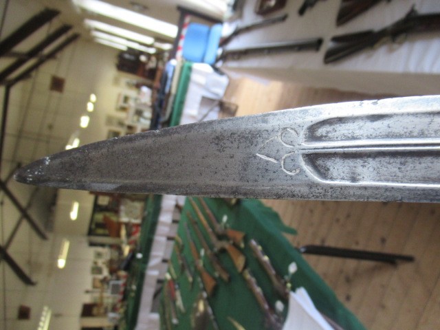 AN INDIAN TALWAR, 19th century, the 29 1/4" curved blade with fine fullers and edge shaping, and Image