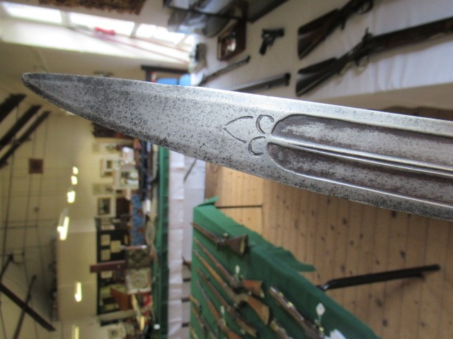 AN INDIAN TALWAR, 19th century, the 29 1/4" curved blade with fine fullers and edge shaping, and Image