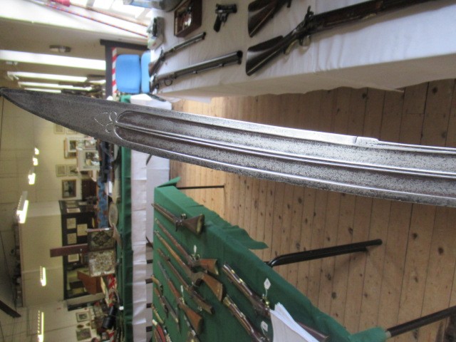 AN INDIAN TALWAR, 19th century, the 29 1/4" curved blade with fine fullers and edge shaping, and Image