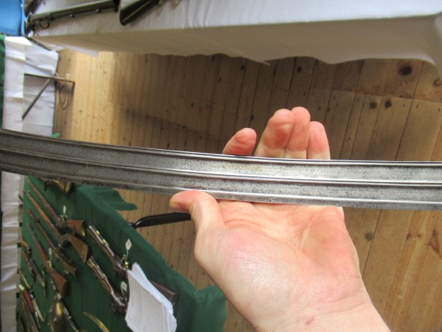 AN INDIAN TALWAR, 19th century, the 29 1/4" curved blade with fine fullers and edge shaping, and Image