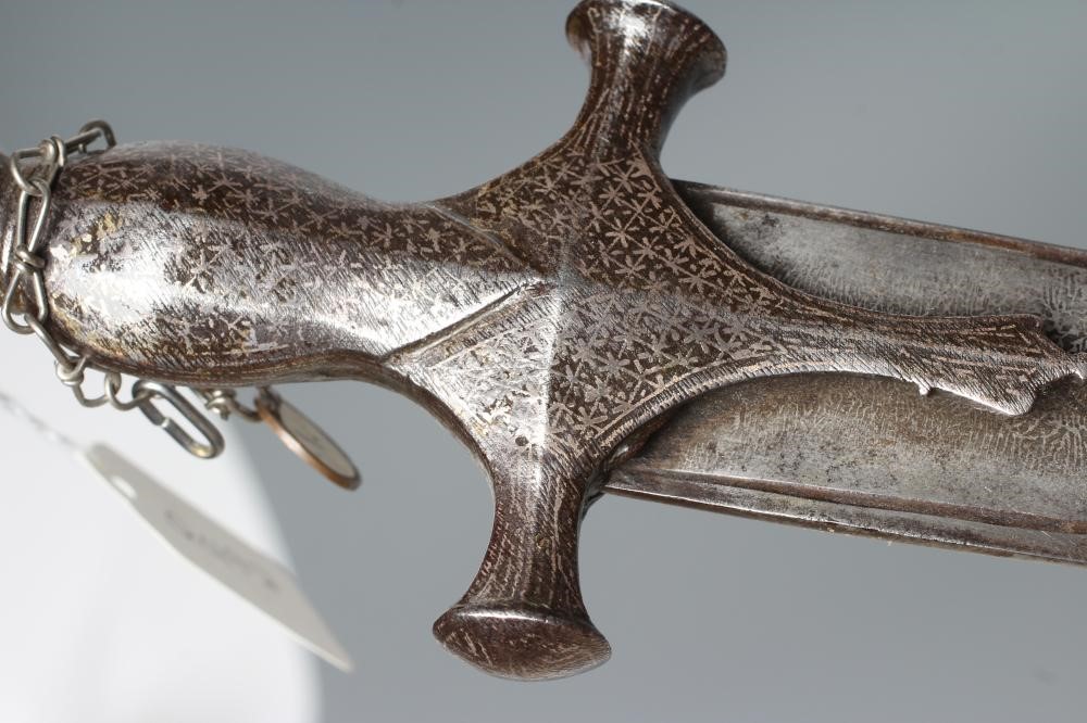 AN INDIAN TALWAR, 19th century, the 29 1/4" curved blade with fine fullers and edge shaping, and Image