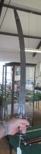 AN INDIAN TALWAR, 19th century, the 29 1/4" curved blade with fine fullers and edge shaping, and Image