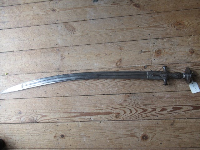 AN INDIAN TALWAR, 19th century, the 29 1/4" curved blade with fine fullers and edge shaping, and Image