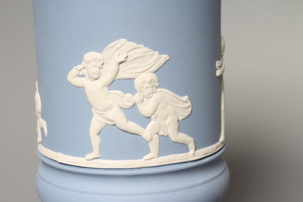 A WEDGWOOD BLUE JASPERWARE PEDESTAL VASE AND COVER, modern, of cylindrical form, moulded and applied Image