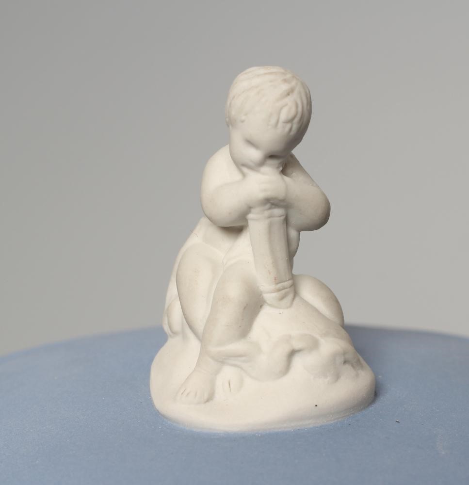 A WEDGWOOD BLUE JASPERWARE PEDESTAL VASE AND COVER, modern, of cylindrical form, moulded and applied Image