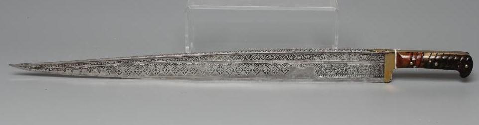 A KHYBER SWORD, late 19th/early 20th century, with 21" deeply etched blade, brass hilt strap and Image