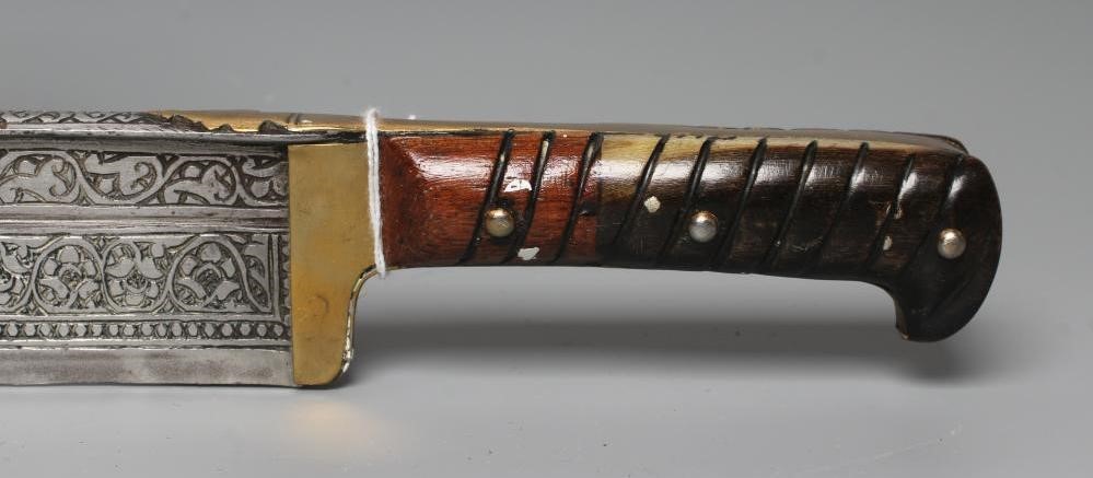 A KHYBER SWORD, late 19th/early 20th century, with 21" deeply etched blade, brass hilt strap and Image