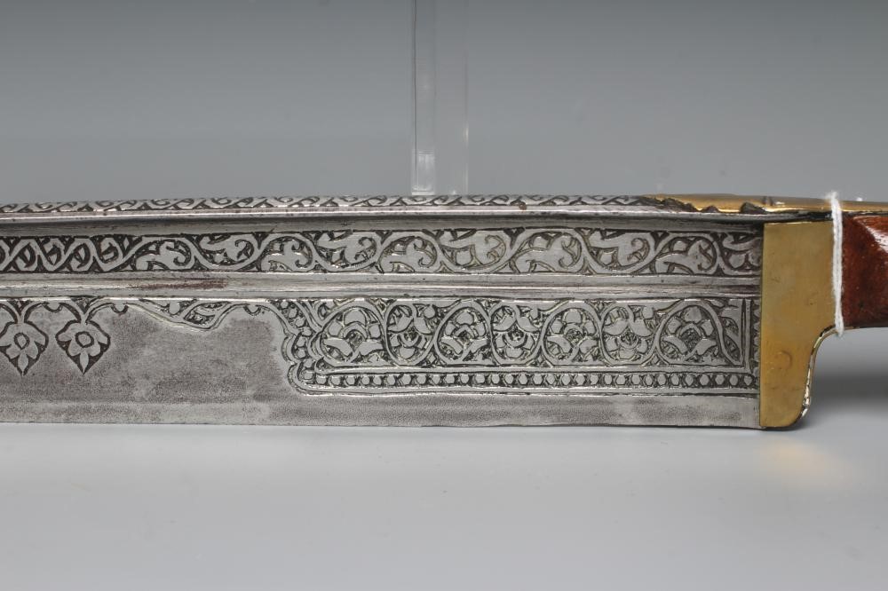 A KHYBER SWORD, late 19th/early 20th century, with 21" deeply etched blade, brass hilt strap and Image