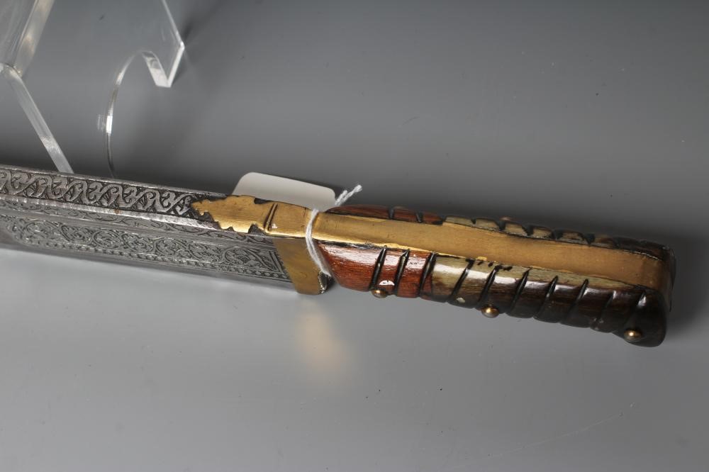 A KHYBER SWORD, late 19th/early 20th century, with 21" deeply etched blade, brass hilt strap and Image