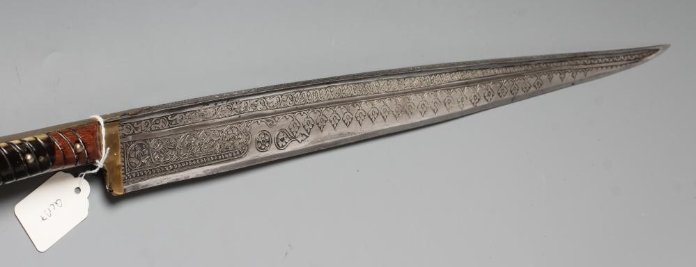 A KHYBER SWORD, late 19th/early 20th century, with 21" deeply etched blade, brass hilt strap and Image