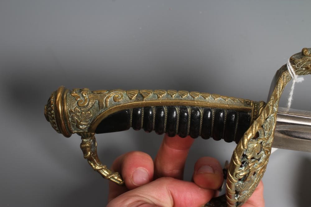A FRENCH NAVAL OFFICER'S SWORD with 27 1/2" blade, brass hilt with dolphin quillon and anchor amid Image