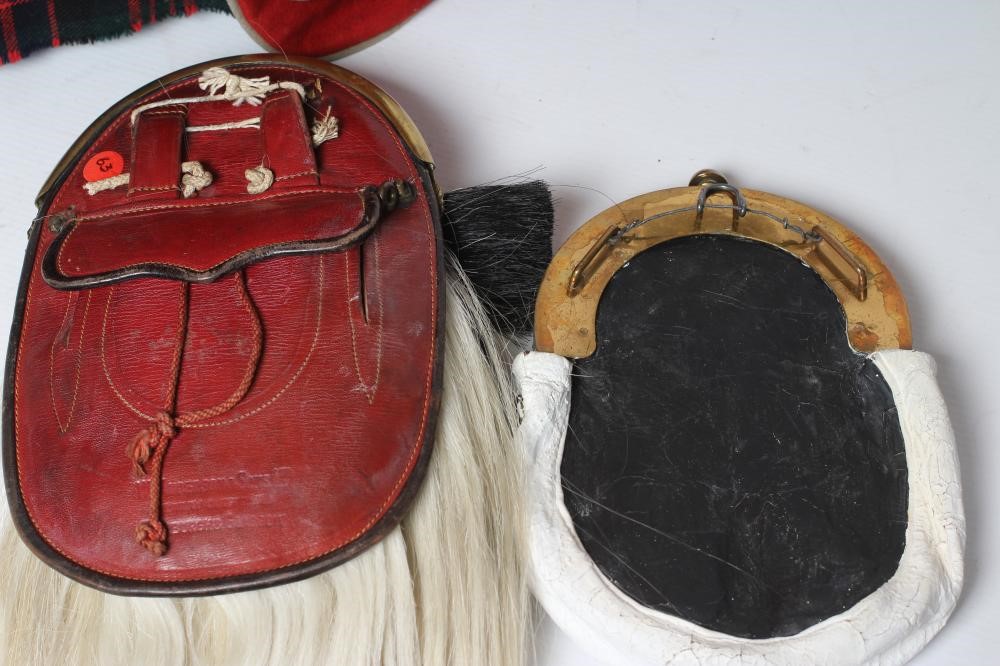 A HIGHLAND LIGHT INFANTRY RED TUNIC, together with a Royal Highland regimetal sporran, and a "Peter Image