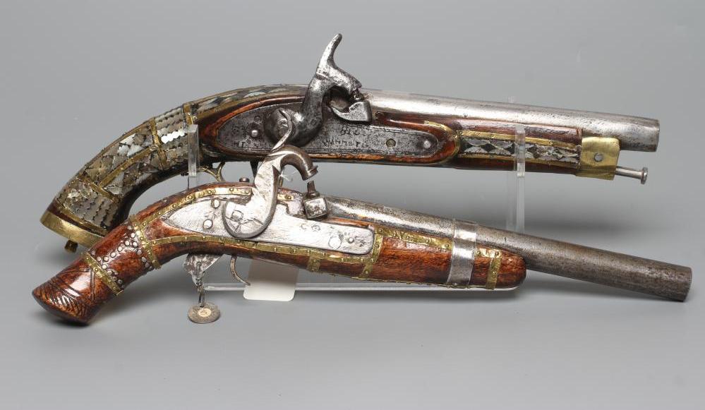 TWO AFGHAN PERCUSSION PISTOLS, one with British style lock and both with decorative stocks including Image