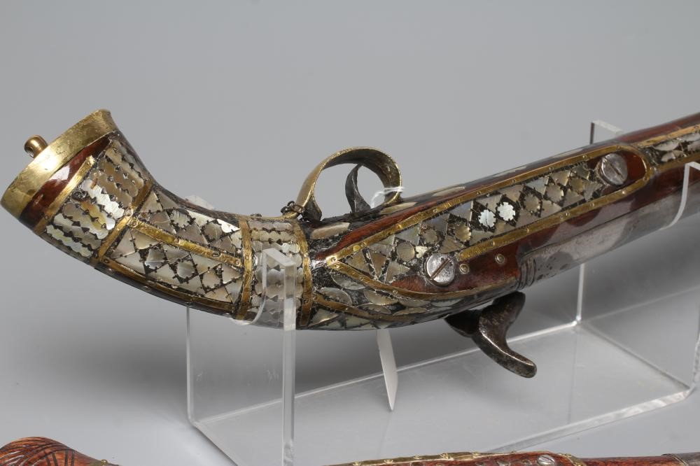TWO AFGHAN PERCUSSION PISTOLS, one with British style lock and both with decorative stocks including Image