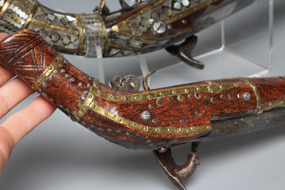TWO AFGHAN PERCUSSION PISTOLS, one with British style lock and both with decorative stocks including Image