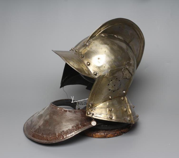 A REPRODUCTION BURGONET HELMET with high medial ridge, rounded peak, neck and ear guards, together Image