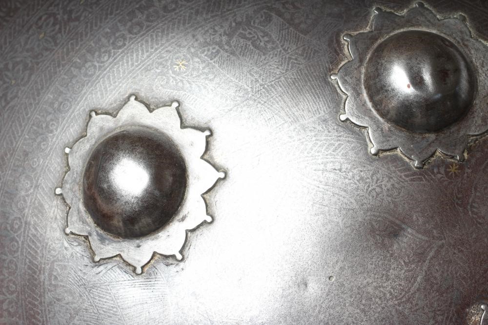 A DHAL SHIELD, with four central bosses, niello like floral decoration and painted interior, Image