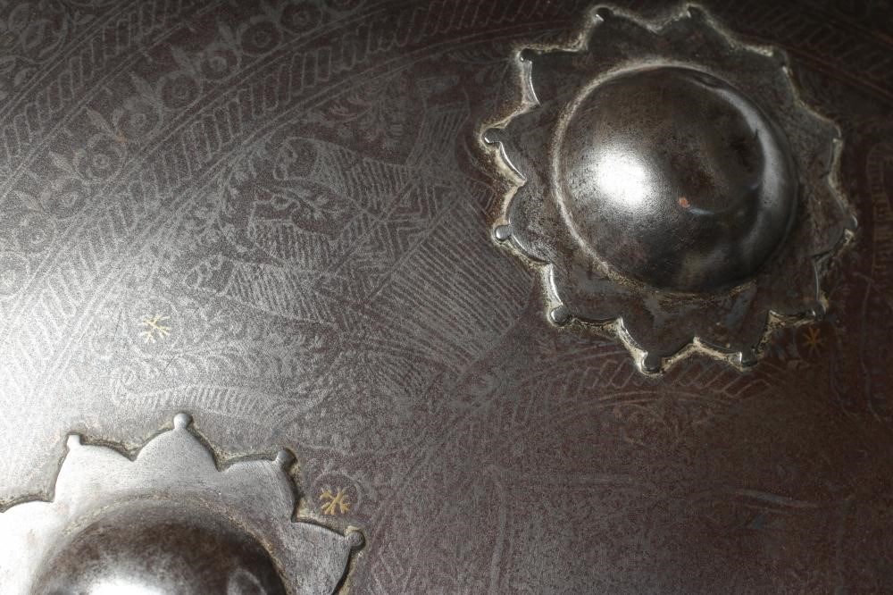 A DHAL SHIELD, with four central bosses, niello like floral decoration and painted interior, Image