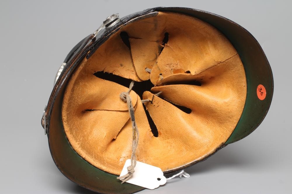 A SECOND WORLD WAR GERMAN POLICE SHAKO, with large metal Third Reich eagle badge, peak, leather chin Image