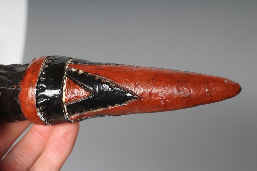 AN OBSIDIAN DAGGER, from Papua New Guinea, with 4 5/8" blade and painted tapering grip, 9 3/4" long Image
