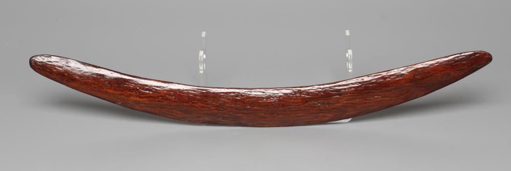 AN ABORIGINAL BOOMERANG with one flat edge and long tooling marks throughout, old label inscribed Image