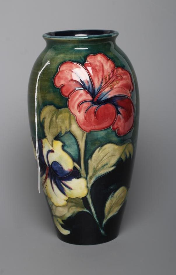 A MOORCROFT POTTERY HIBISCUS PATTERN VASE, mid 20th century, of rounded cylindrical form, tubelined Image