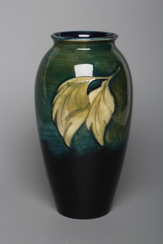 A MOORCROFT POTTERY HIBISCUS PATTERN VASE, mid 20th century, of rounded cylindrical form, tubelined Image