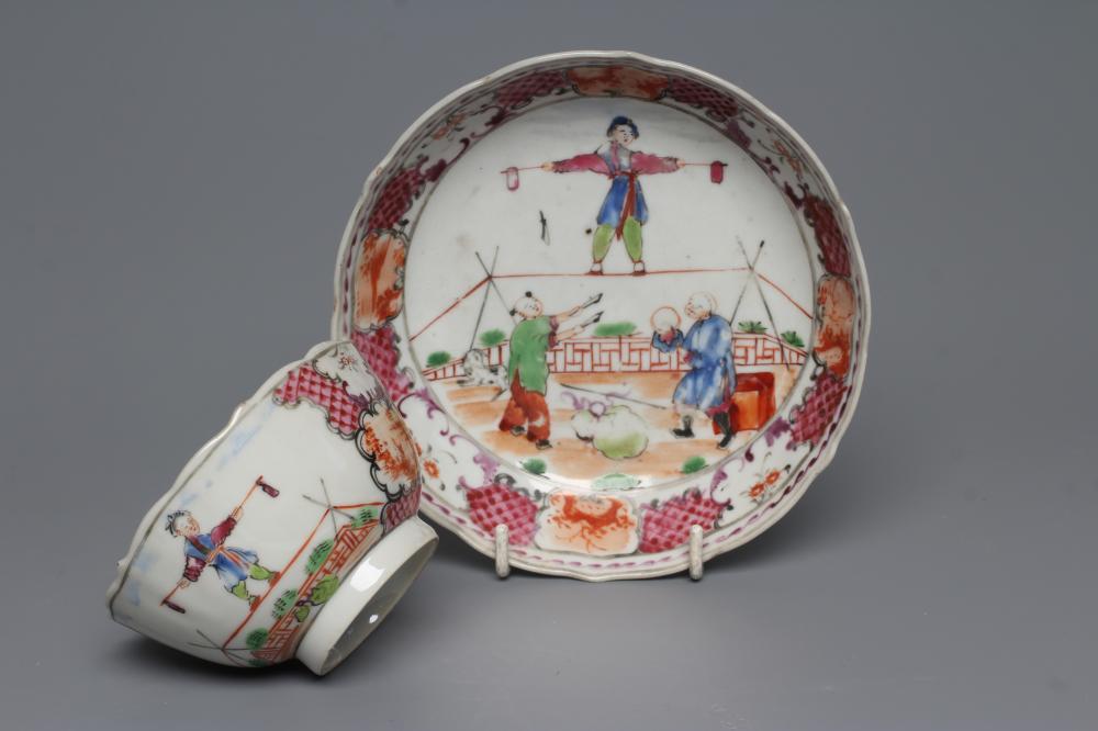 A CHINESE PORCELAIN FAMILLE ROSE TEA BOWL AND SAUCER painted with a tightrope walker and a knife Image