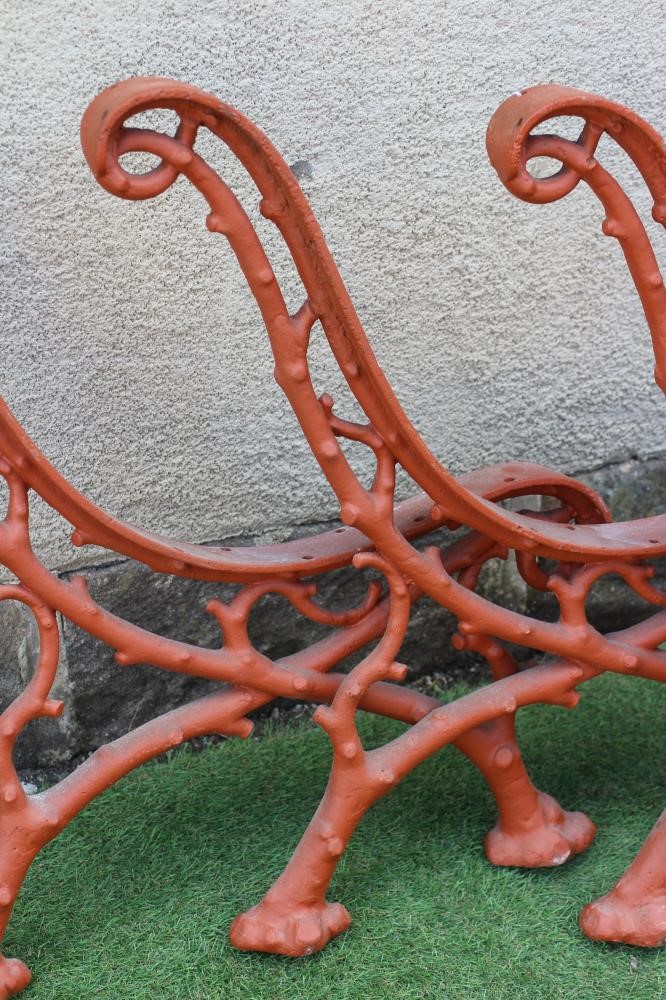 A SET OF THREE VICTORIAN CAST IRON PARK BENCH SUPPORTS in truncated branch pattern, 26 1/2" x 29" Image