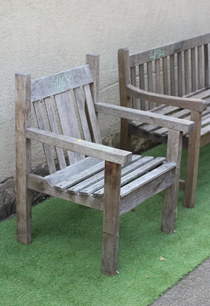 A SLATTED TEAK BENCH with straight back and square section arm suppports and feet, 48" x 18 1/2" x Image