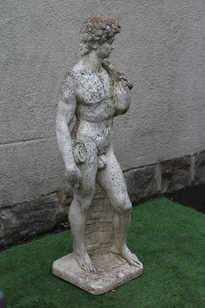 A CAST STONE FIGURE OF DAVID after Michelangelo, on an oblong base, 13" x 47 (Est. plus 24% premium Image