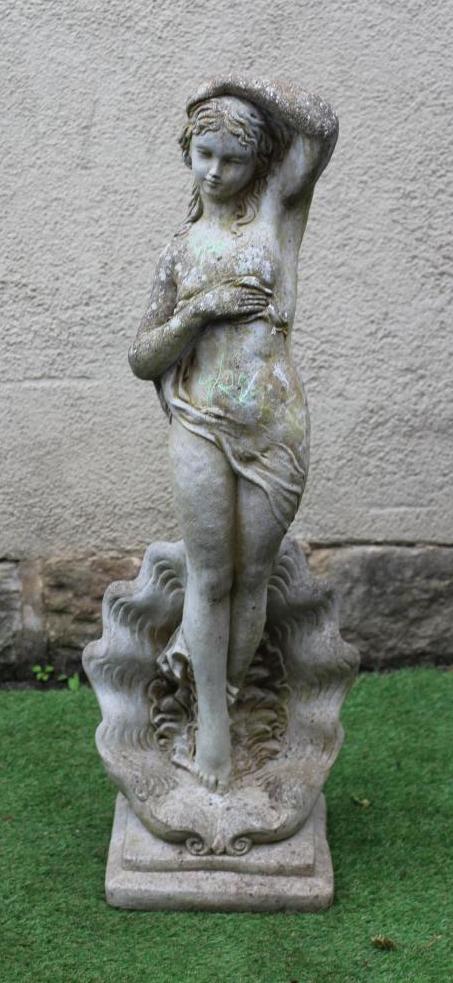 A CAST STONE FIGURE OF VENUS after Botticelli's "The Birth of Venus", on a stepped square base, 12" Image