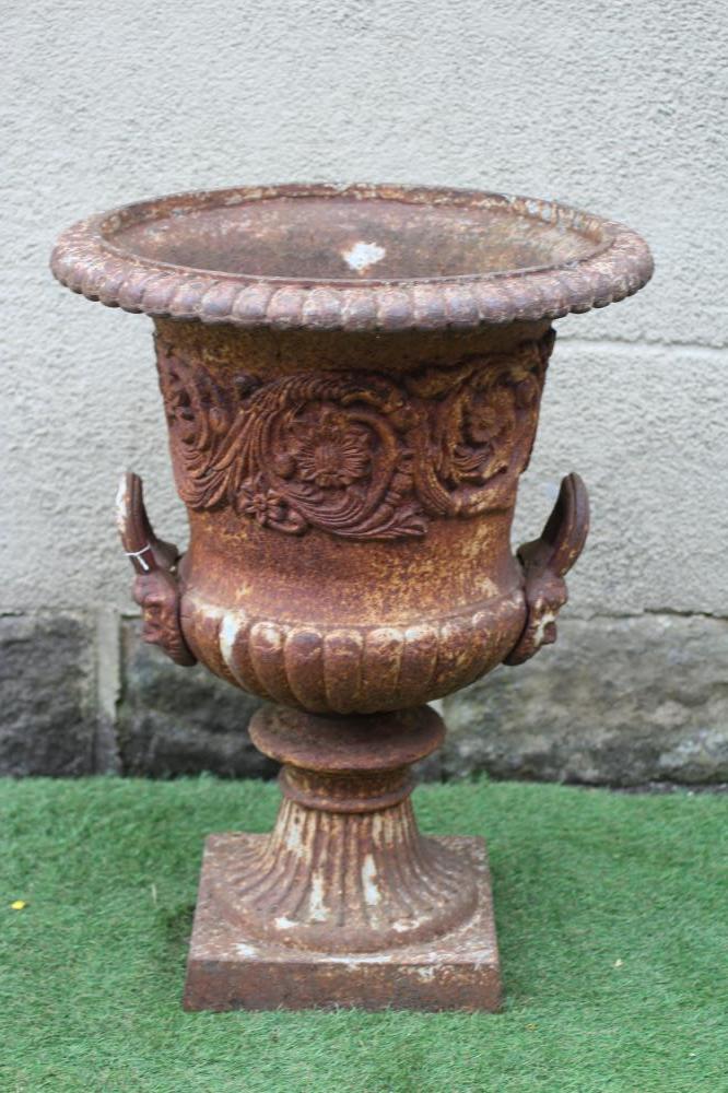 A VICTORIAN CAST IRON URN of half fluted campana form with everted ovolo moulded rim and mask loop Image