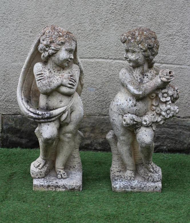 A PAIR OF CAST STONE FIGURES allegorical of Winter and Summer, on square base, 33" high (Est. plus Image