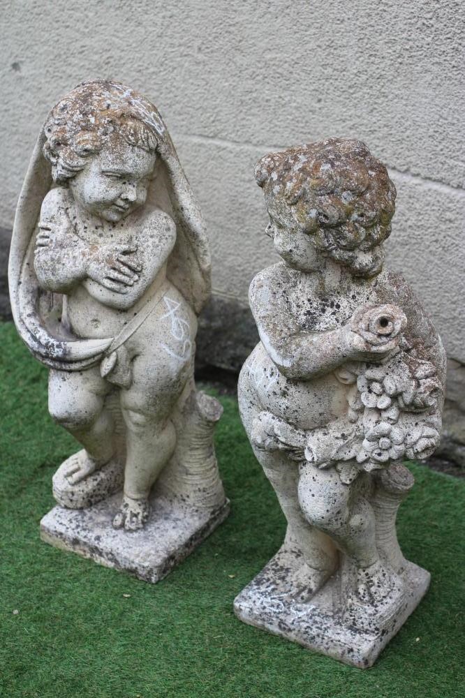 A PAIR OF CAST STONE FIGURES allegorical of Winter and Summer, on square base, 33" high (Est. plus Image