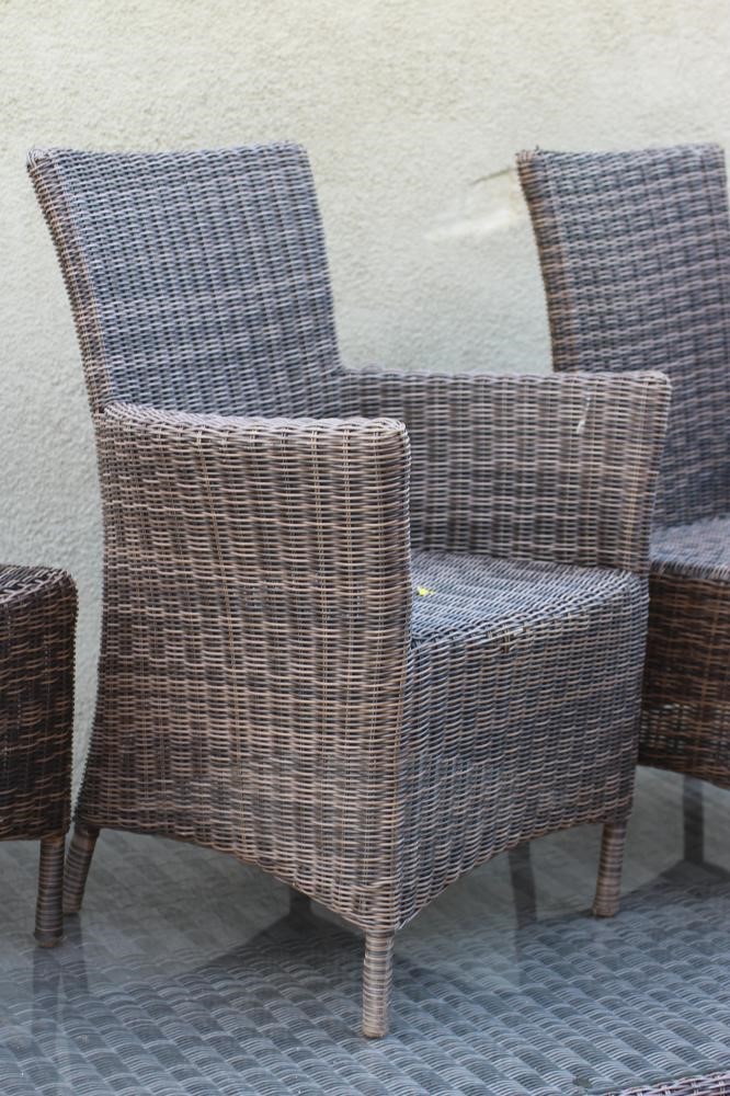 AN ALL WEATHER RESIN WEAVE DINING SUITE Image