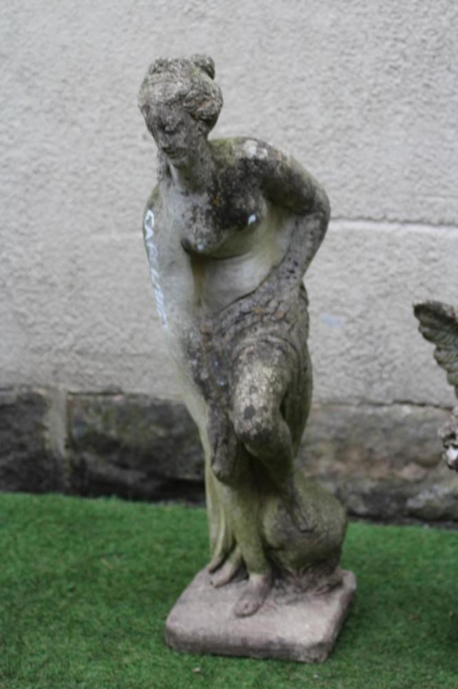 A CAST STONE FIGURE OF VENUS, together with a figure of a winged cherub holding a bouquet, 35 1/2" x Image