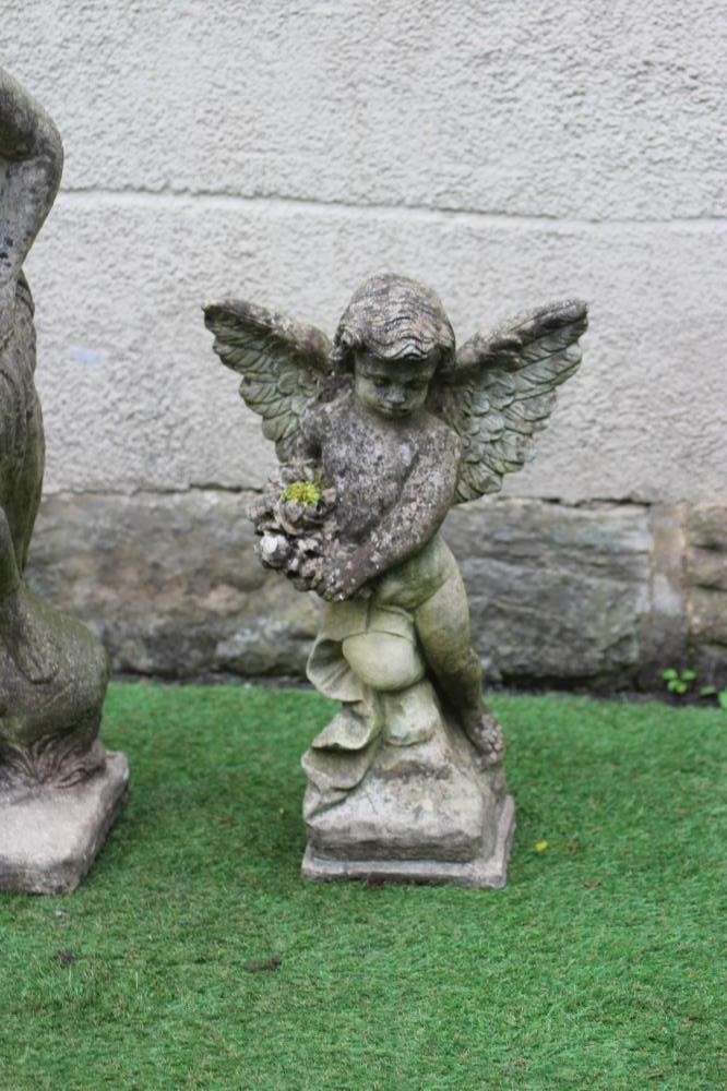 A CAST STONE FIGURE OF VENUS, together with a figure of a winged cherub holding a bouquet, 35 1/2" x Image