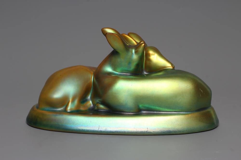 A ZSOLNAY PECS GREEN IRIDESCENT POTTERY MODEL, mid 20th century, of two recumbent deer, printed gilt Image
