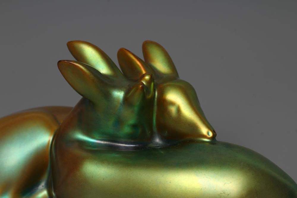 A ZSOLNAY PECS GREEN IRIDESCENT POTTERY MODEL, mid 20th century, of two recumbent deer, printed gilt Image