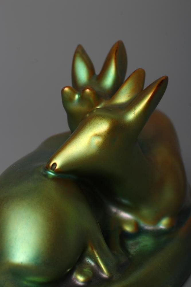 A ZSOLNAY PECS GREEN IRIDESCENT POTTERY MODEL, mid 20th century, of two recumbent deer, printed gilt Image