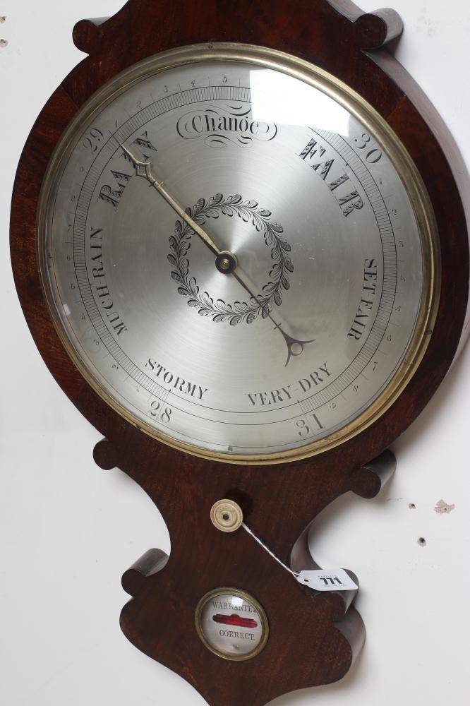 A LARGE MAHOGANY WHEEL BAROMETER Image