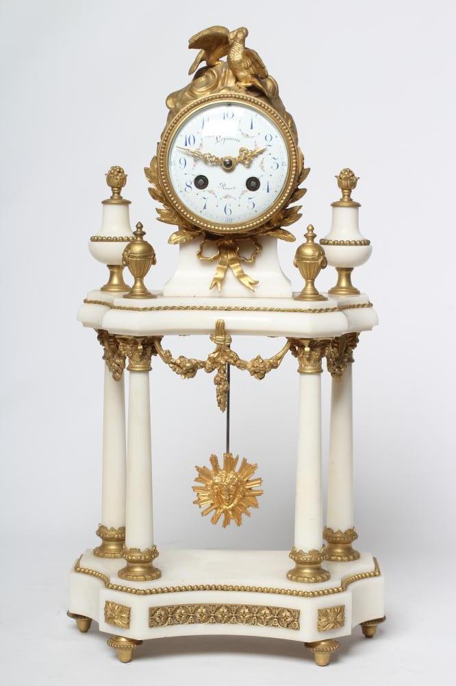 A GILT METAL AND WHITE MARBLE PORTICO CLOCK Image