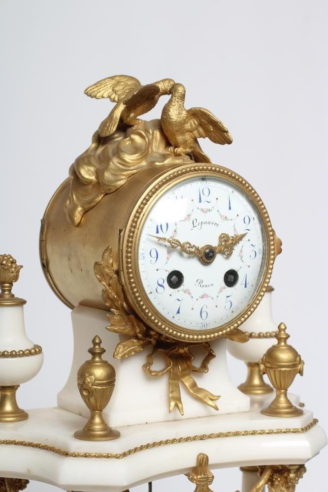 A GILT METAL AND WHITE MARBLE PORTICO CLOCK Image