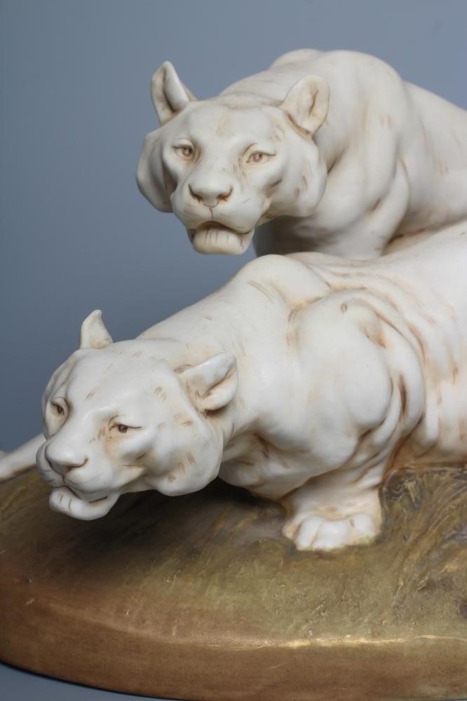 A ROYAL DUX BISQUE PORCELAIN MODEL OF TWO LIONESSES Image