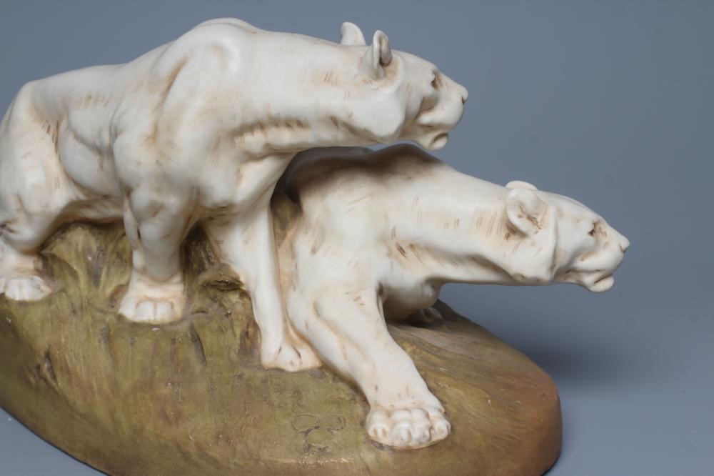 A ROYAL DUX BISQUE PORCELAIN MODEL OF TWO LIONESSES Image