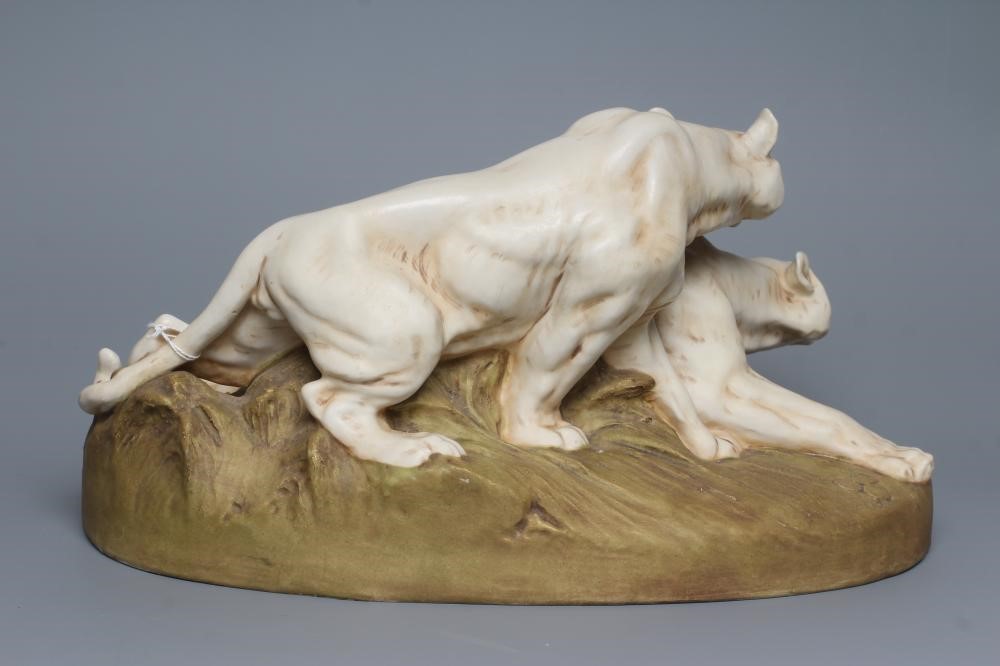 A ROYAL DUX BISQUE PORCELAIN MODEL OF TWO LIONESSES Image