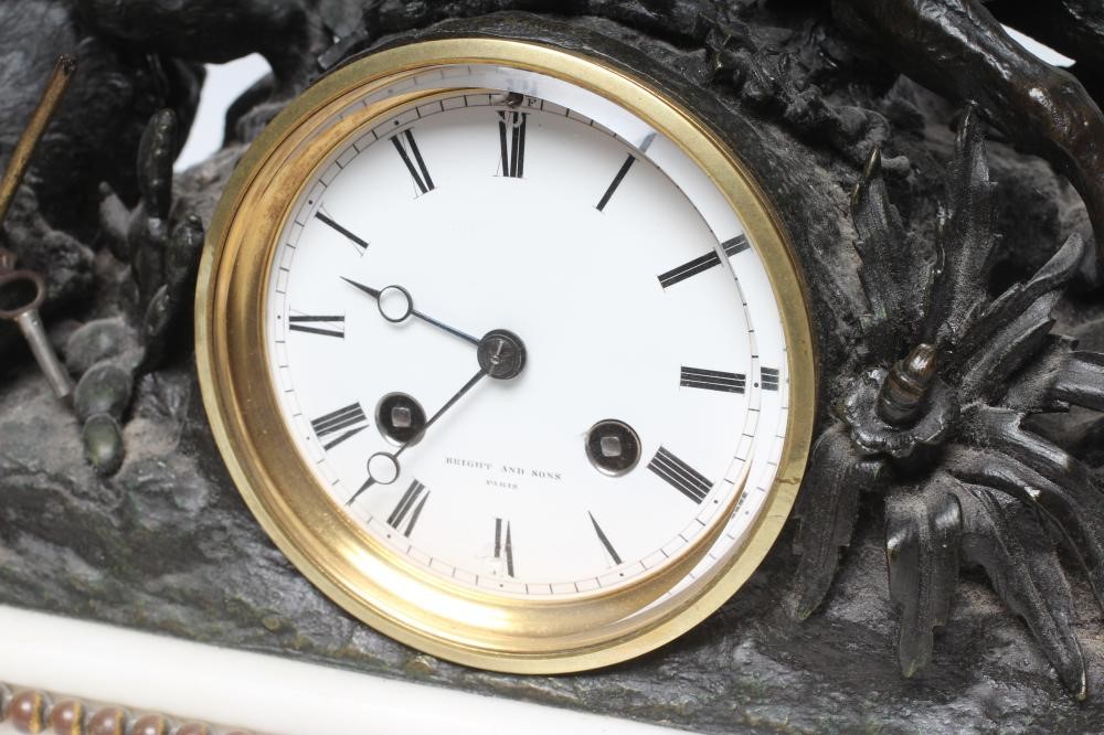 A FRENCH SPELTER AND WHITE MARBLE MANTEL CLOCK Image