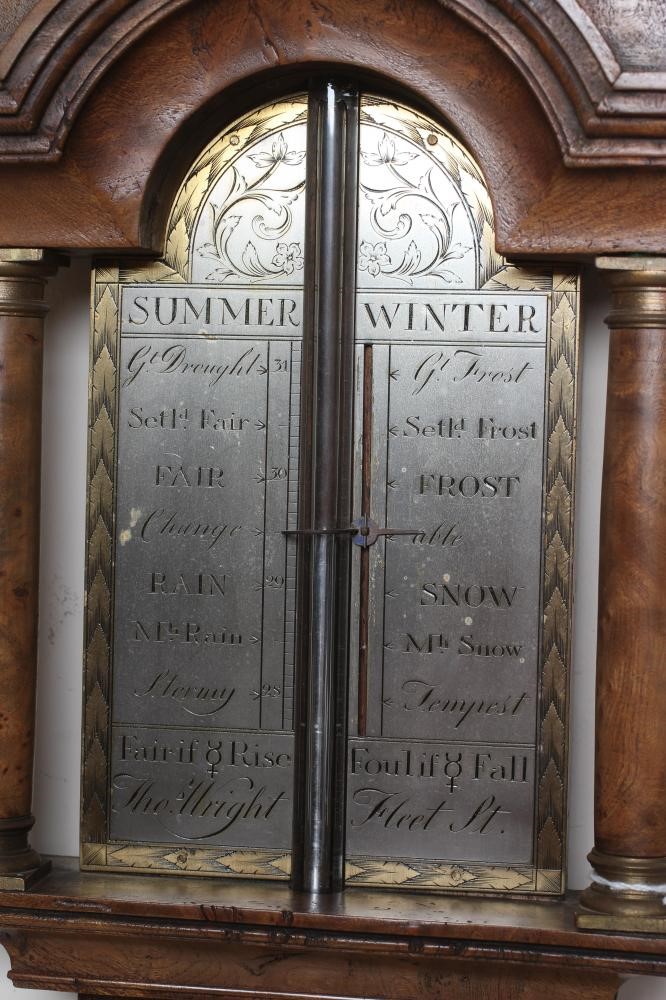 A BURR WALNUT STICK BAROMETER Image