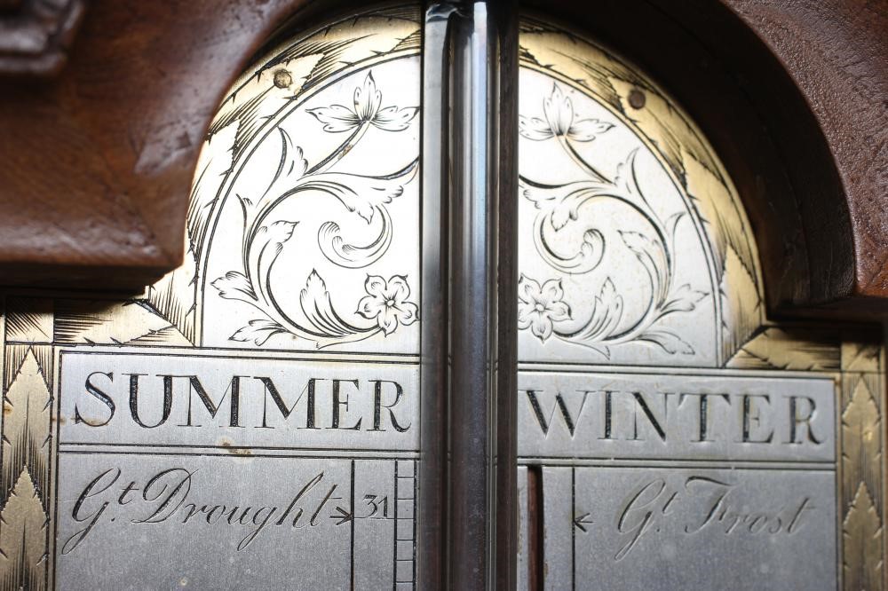 A BURR WALNUT STICK BAROMETER Image